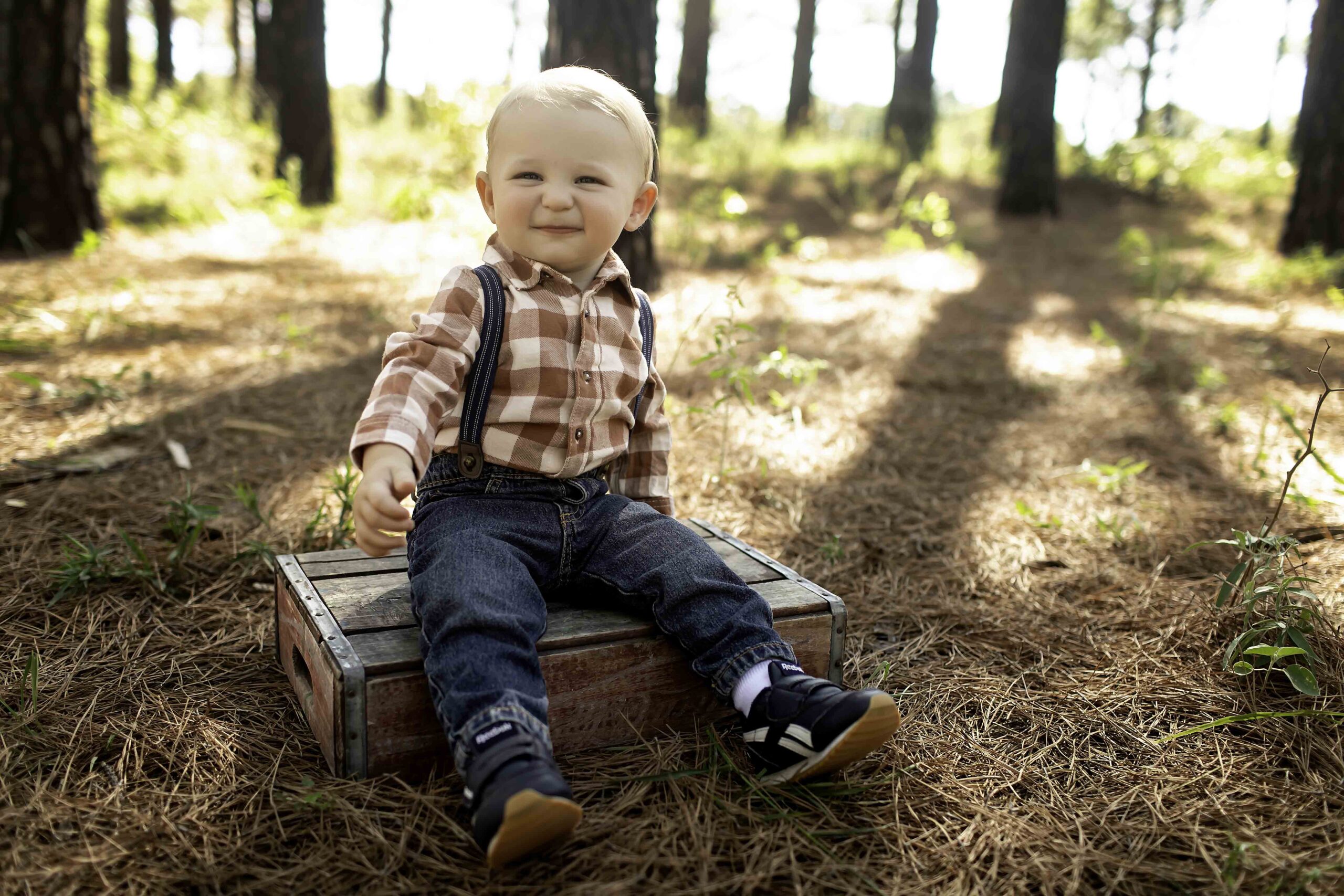 Birthday boy in pine trees in Decatur TX