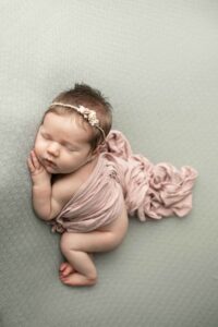 Newborn Baby Girl with a pink wrap 
