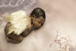 Chunky Monkey Newborn Baby Girl in Studio with angel wings