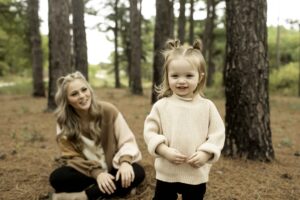 Mom and Daughter in Pine Trees 