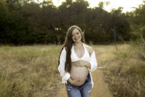 Maternity session with mama in white shirt in nature