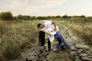 Maternity session with mama in white shirt in nature with dad