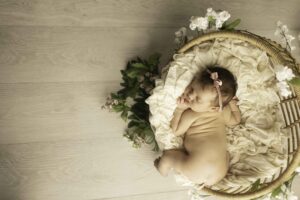 Newborn Baby Girl in a basket with boho setting