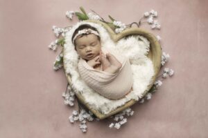 Newborn Baby Girl in heart prop