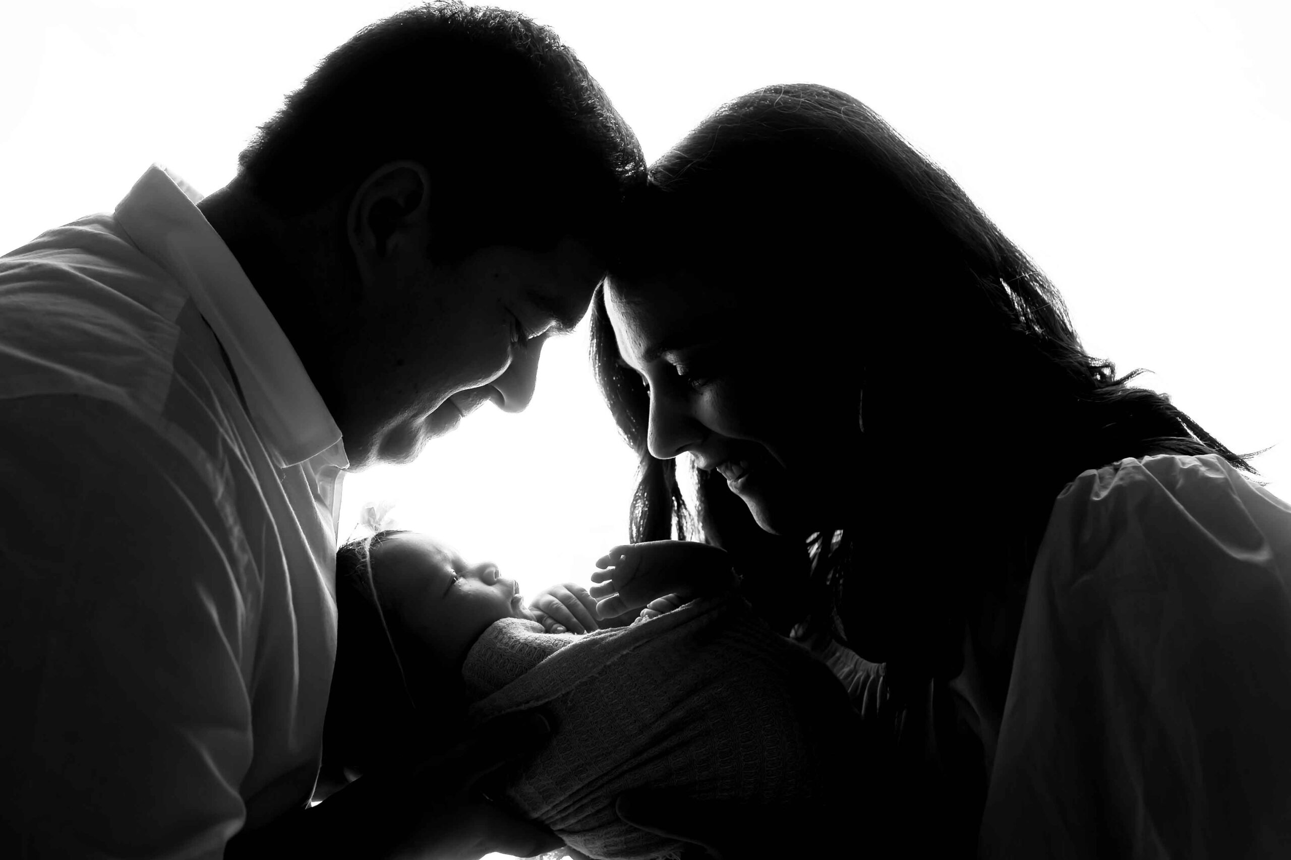 Newborn Baby Girl backlit with mom and dad