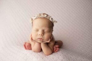 Newborn Baby Girl on Purple Blanket Froggy Pose
