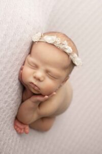 Newborn Baby Girl on Purple Blanket