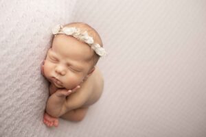 Newborn Baby Girl on Purple Blanket