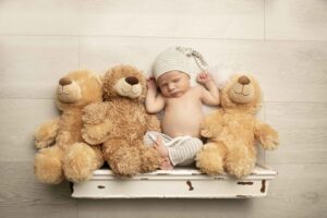 Newborn Baby Boy on a shelf with teddy bears