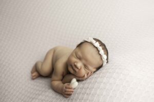 Fort Worth Newborn Baby Girl holding a heart 