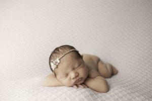 Fort Worth Newborn Baby Girl  head on hands 
