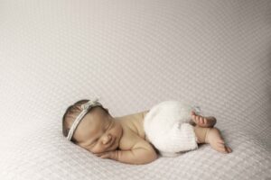 Fort Worth Newborn Baby Girl side laying 