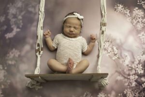 Fort Worth Newborn Baby Girl on s swing