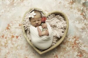 Fort Worth Newborn Baby Girl in a heart prop 