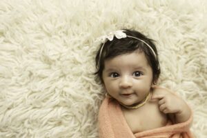 Newborn Baby Girl smiling 