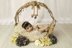 Newborn Baby Girl in hanging basket 