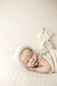 Newborn Baby Boy on white blanket
