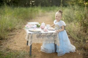 Child as a princess with a tea party