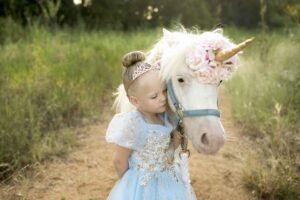 Child as a princess with a unicorn