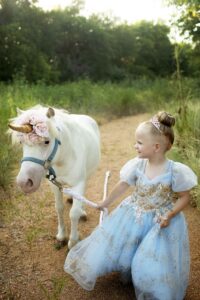 Child as a princess with a unicorn