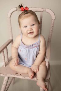 Sitter Milestone Baby Sitting in pink high chair