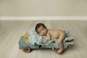 Newborn Baby Boy in truck prop