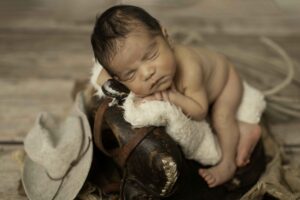 Newborn Baby Boy on saddle