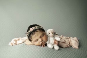 Newborn Baby Girl with lamb stuffy