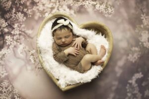 Newborn Baby Girl in Heart 