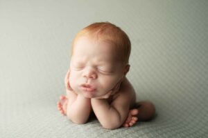 Newborn Baby Boy with Red hair in froggy pose