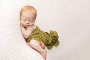 Newborn Baby Boy with Red Hair with green wrap