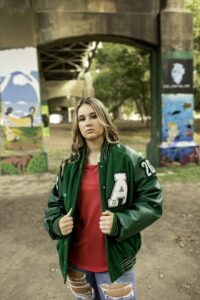 Senior Session with Girl in Fort Worth  at Trinity Park with Letterman Jacket
