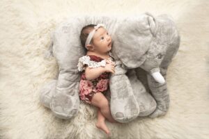 Newborn Baby Girl with elephant doll