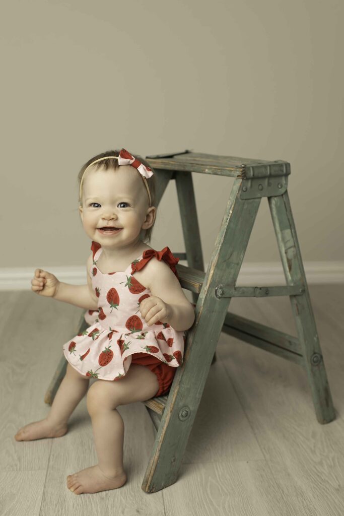 A delightful twin moment with a mini ladder in the studio, as Chunky Monkey Photography captures their joyful energy and sweet expressions