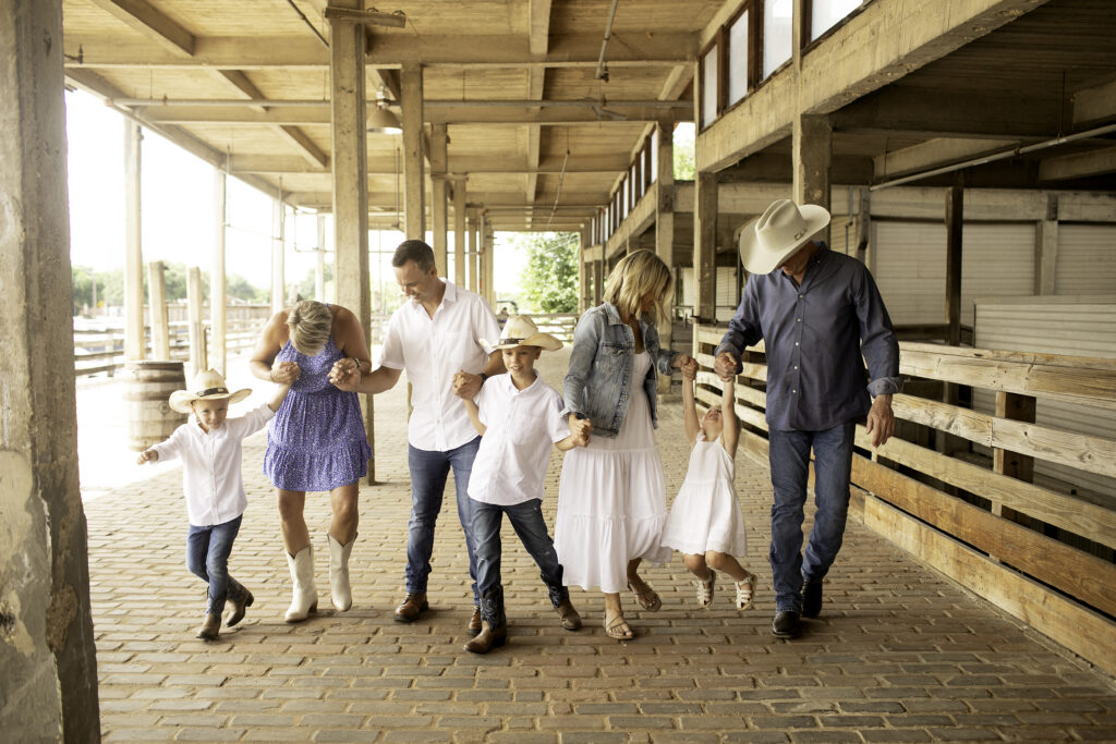 A joyful family portrait in Dallas-Fort Worth, filled with love and smiles, captured by Chunky Monkey Photography at the Stockyards 