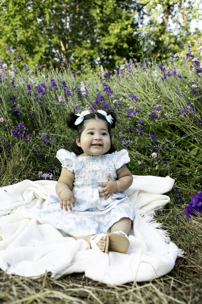 A carefree wildflower photoshoot in Richardson, TX, with sunlight illuminating the subject and the vibrant wildflowers, captured by Chunky Monkey Photography