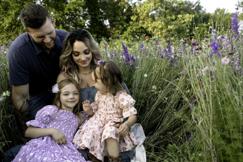 A whimsical photoshoot surrounded by colorful wildflowers in Richardson, TX, captured with love by Chunky Monkey Photography