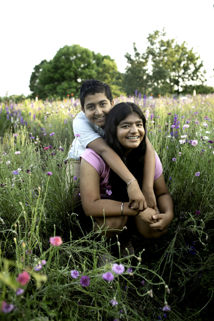 A stunning portrait amidst a field of wildflowers in Richardson, TX, capturing natural beauty and peace, photographed by Chunky Monkey Photography