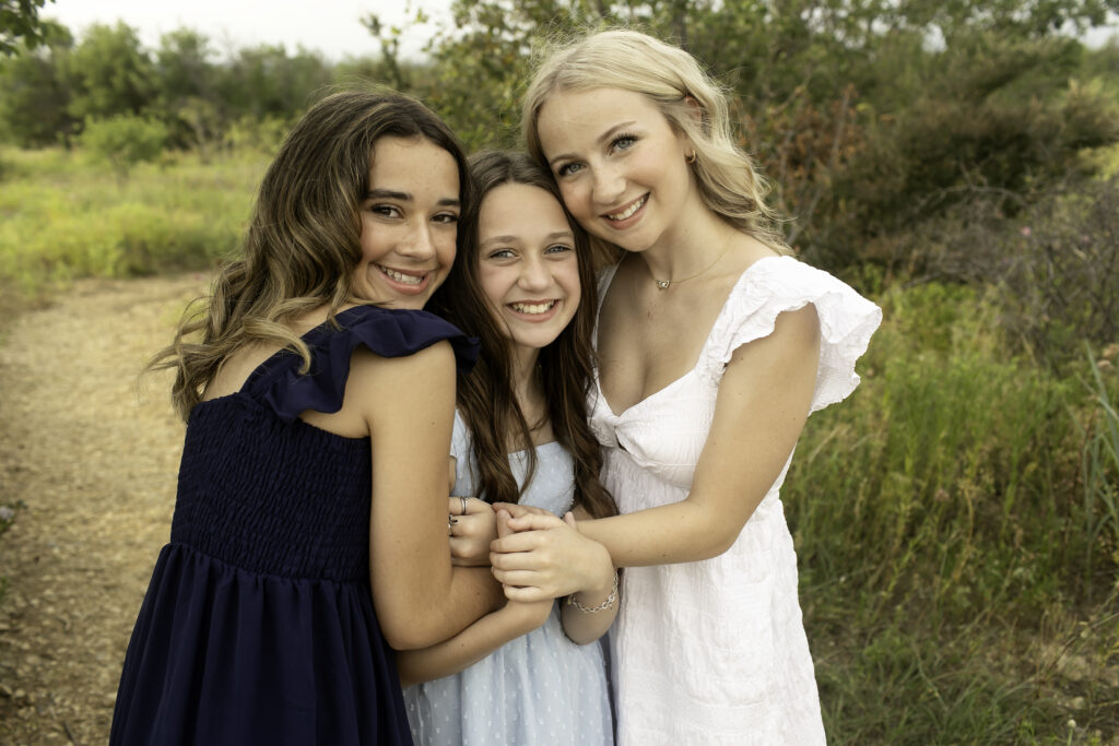 The bond between three sisters shines at Tandy Hills in Fort Worth, capturing their laughter and joy in the beautiful outdoors