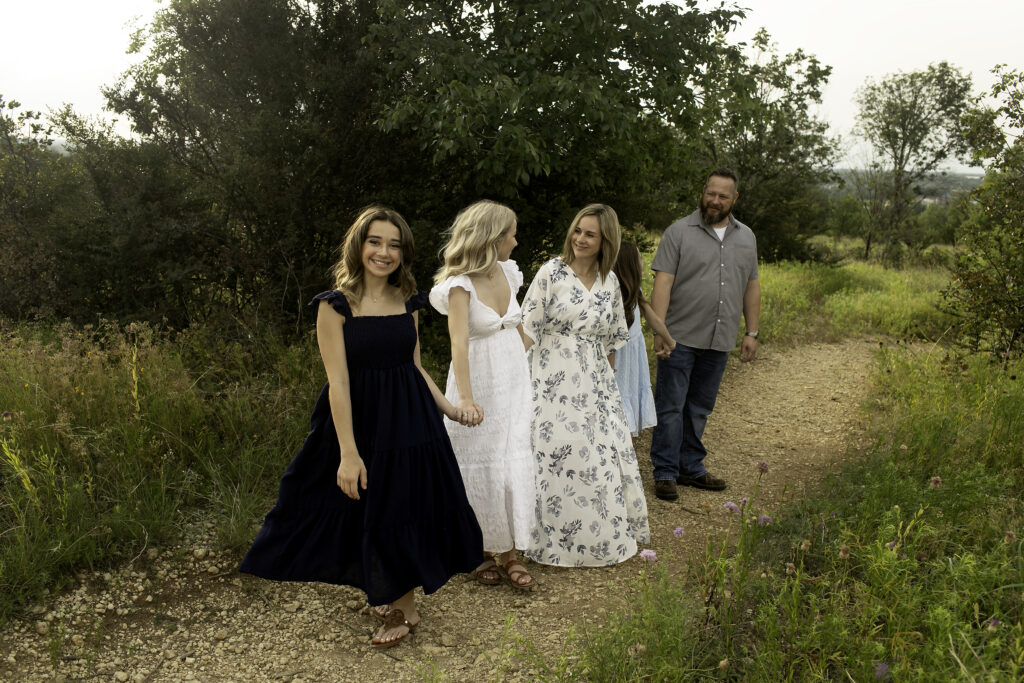 Capturing the bond of a family of five in the beautiful Tandy Hills, with the three sisters and their parents cherishing their time together before the oldest starts college