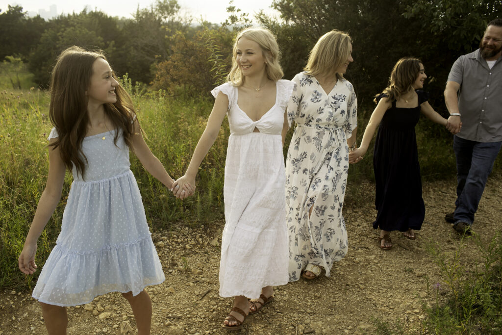 A unique family photoshoot with three sisters at Tandy Hills in Fort Worth, full of natural moments before the eldest leaves for her college adventure