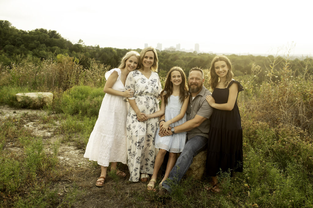 A bohemian-style family photoshoot at Tandy Hills, with three sisters capturing their connection before the oldest embarks on her college adventure