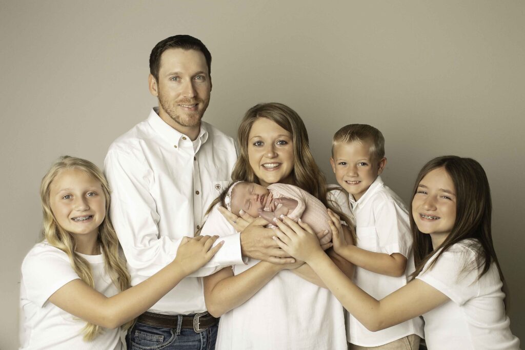 A heartwarming family photo, capturing the love and joy of parents and their children together, beautifully shot by Chunky Monkey Photography