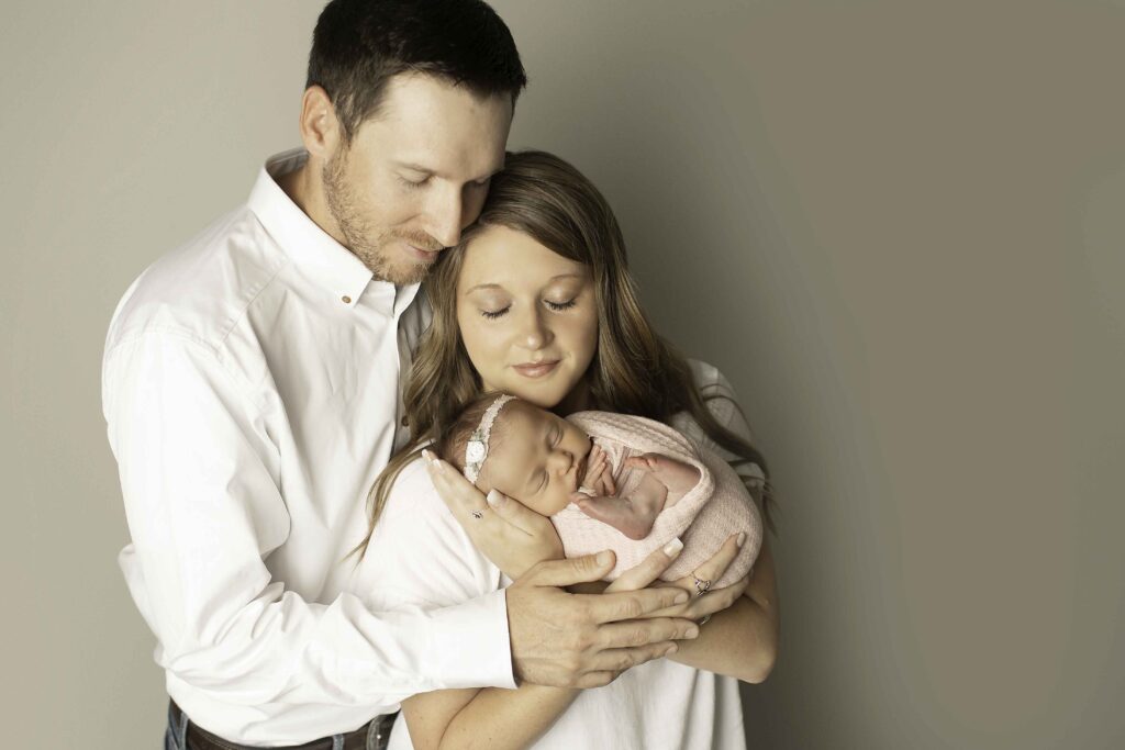 A sweet and intimate moment between mom and dad, sharing a loving embrace, captured by Chunky Monkey Photography