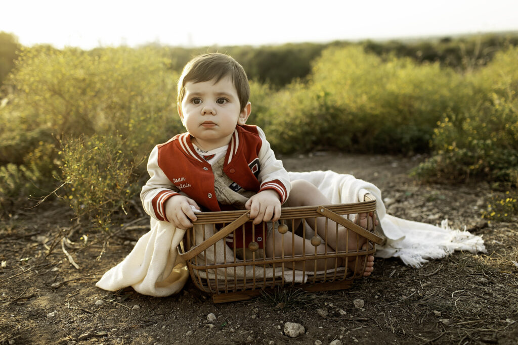 6-month-old boy having a blast, surrounded by the vibrant landscape of Tandy Hills during his photoshoot