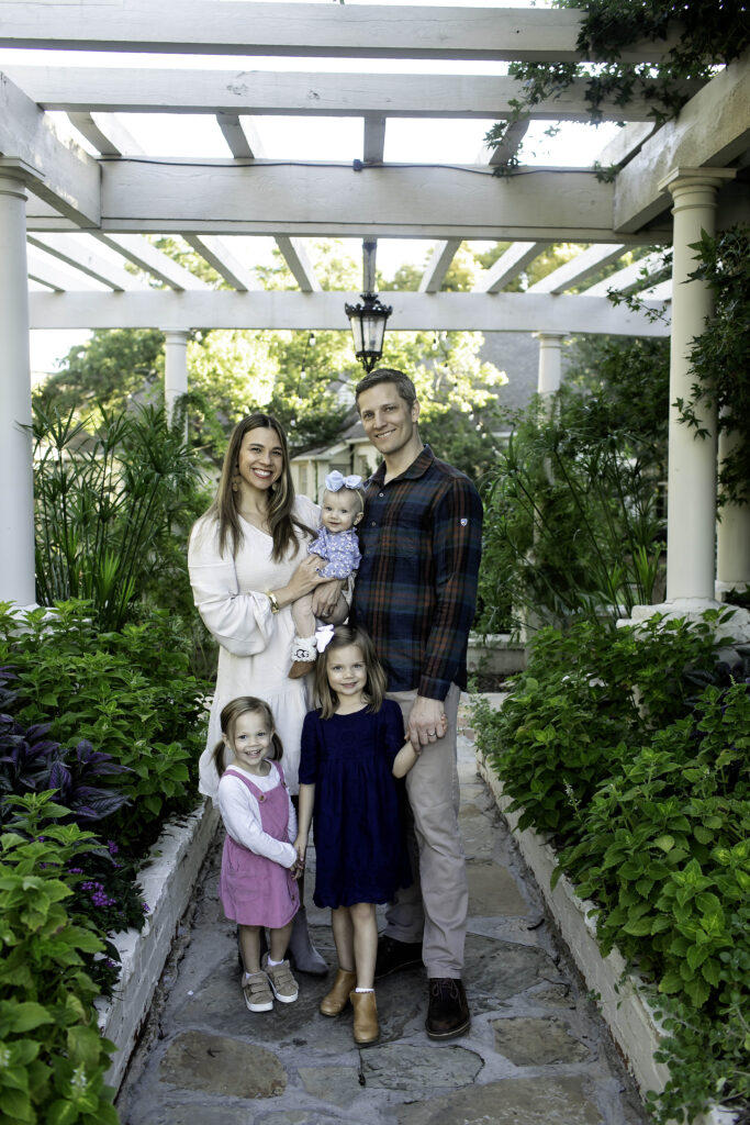 Beautiful family portrait captured among the serene flowers and trees of Chandor Gardens