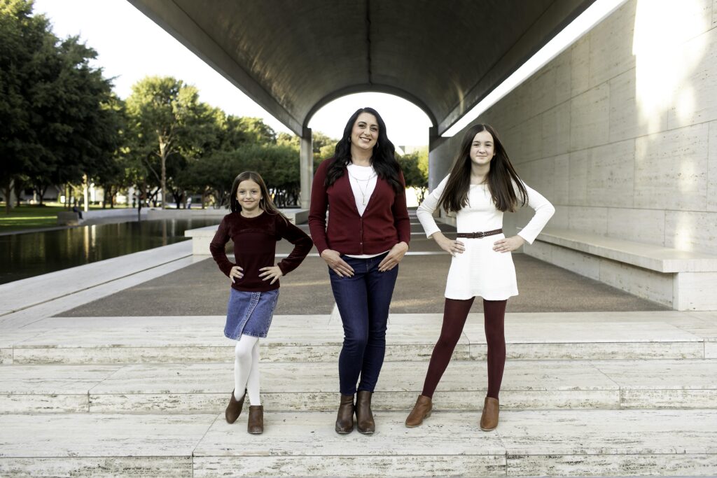 A family of four shares a happy moment in Dallas-Fort Worth, radiating warmth and affection, beautifully captured at Kimball Art 