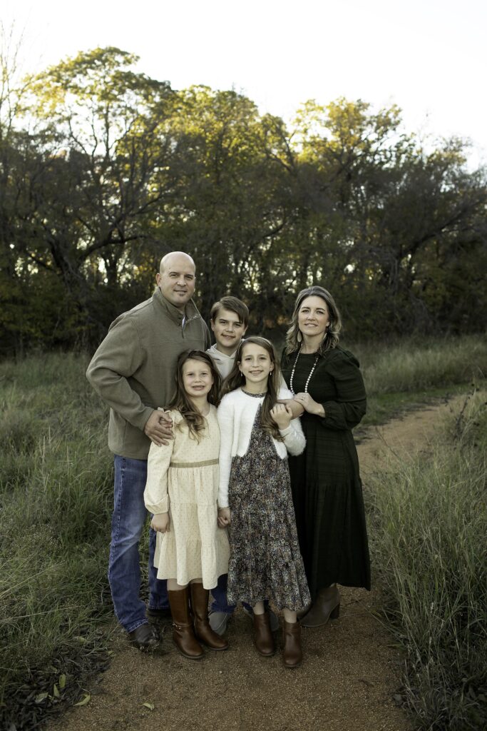 Family photo at Northwest Community Park, with everyone laughing and enjoying their time outdoors