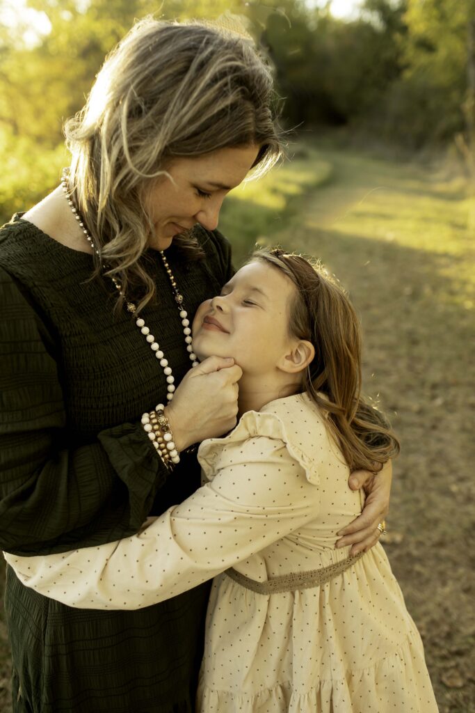 Parent and child enjoying a quiet moment together at Northwest Community Park, with the child looking up happily