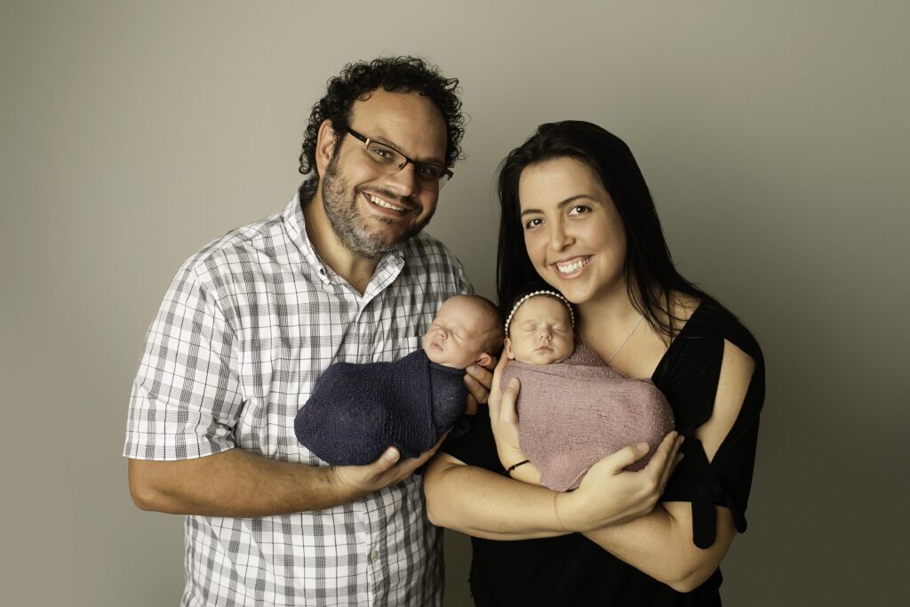 Newborn twin session capturing the bond between two sweet siblings